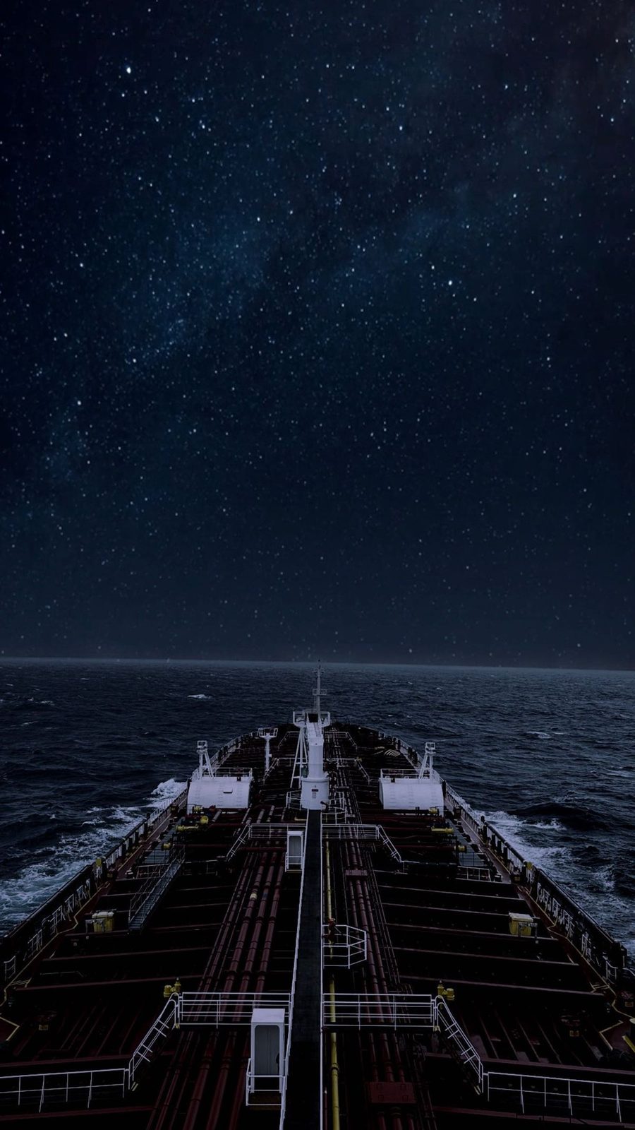 Tanker deck at night under a clear starfield